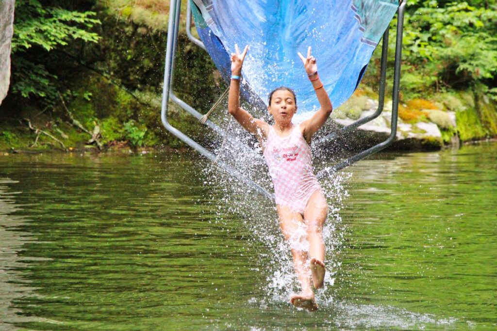 water slide peace sign kid