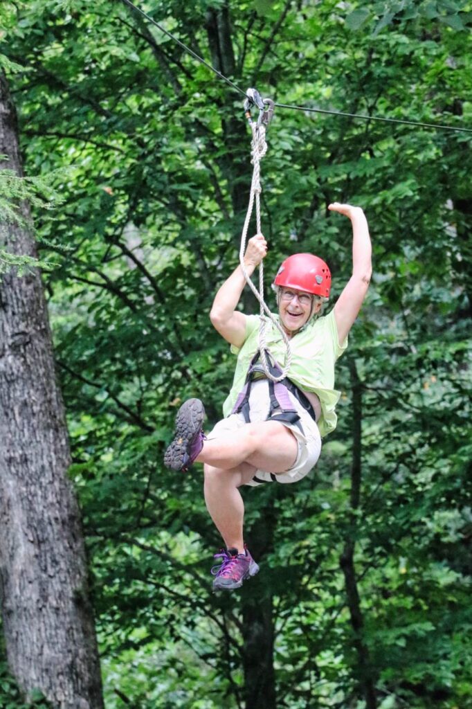 alumna zip lining smile