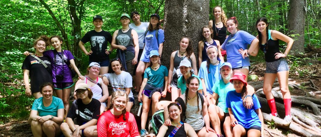 mimi hiking group around tree