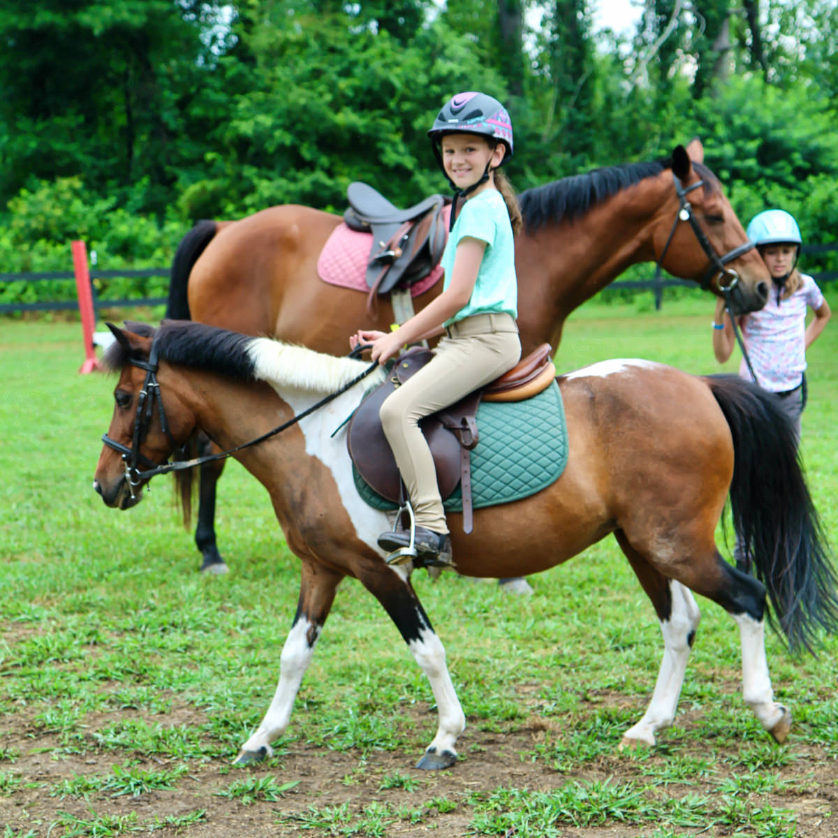 camp girl riding pony
