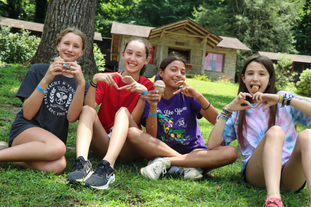 summer camp kids making heart