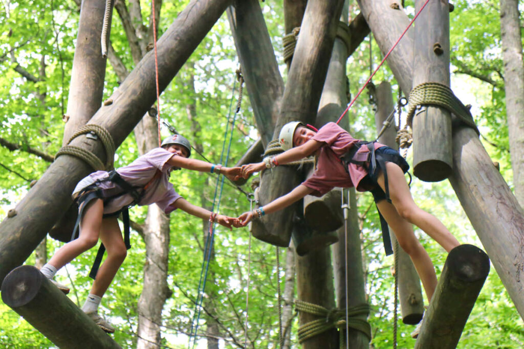 challenge course climbing pair