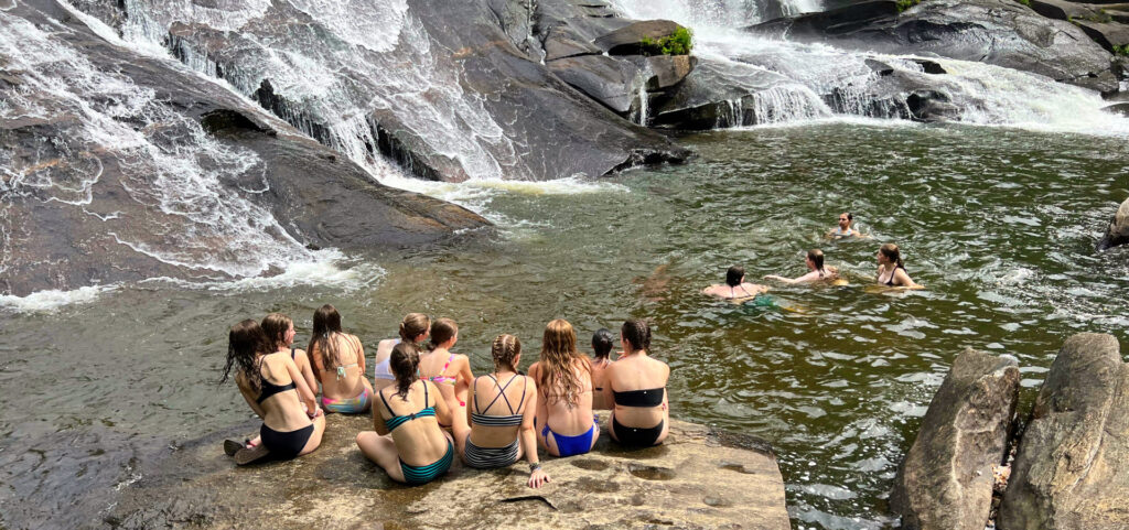 girls waterfall swimming