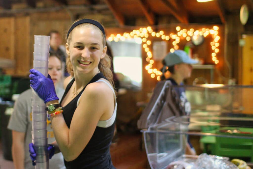 camp girl doing dining hall chores