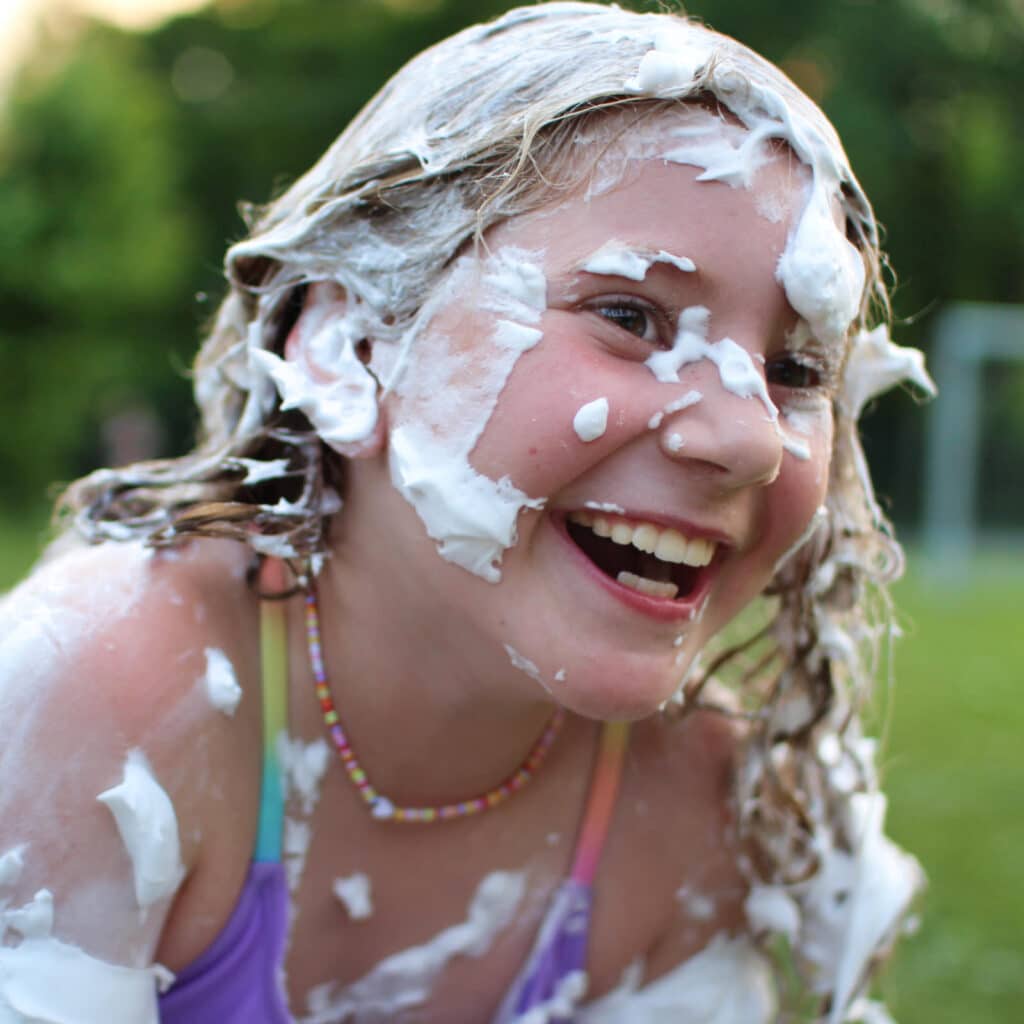 camp gril shaving cream in hair