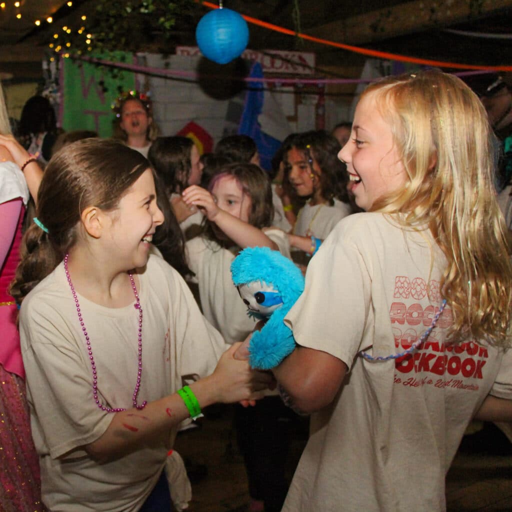 smiling camp girls dancing