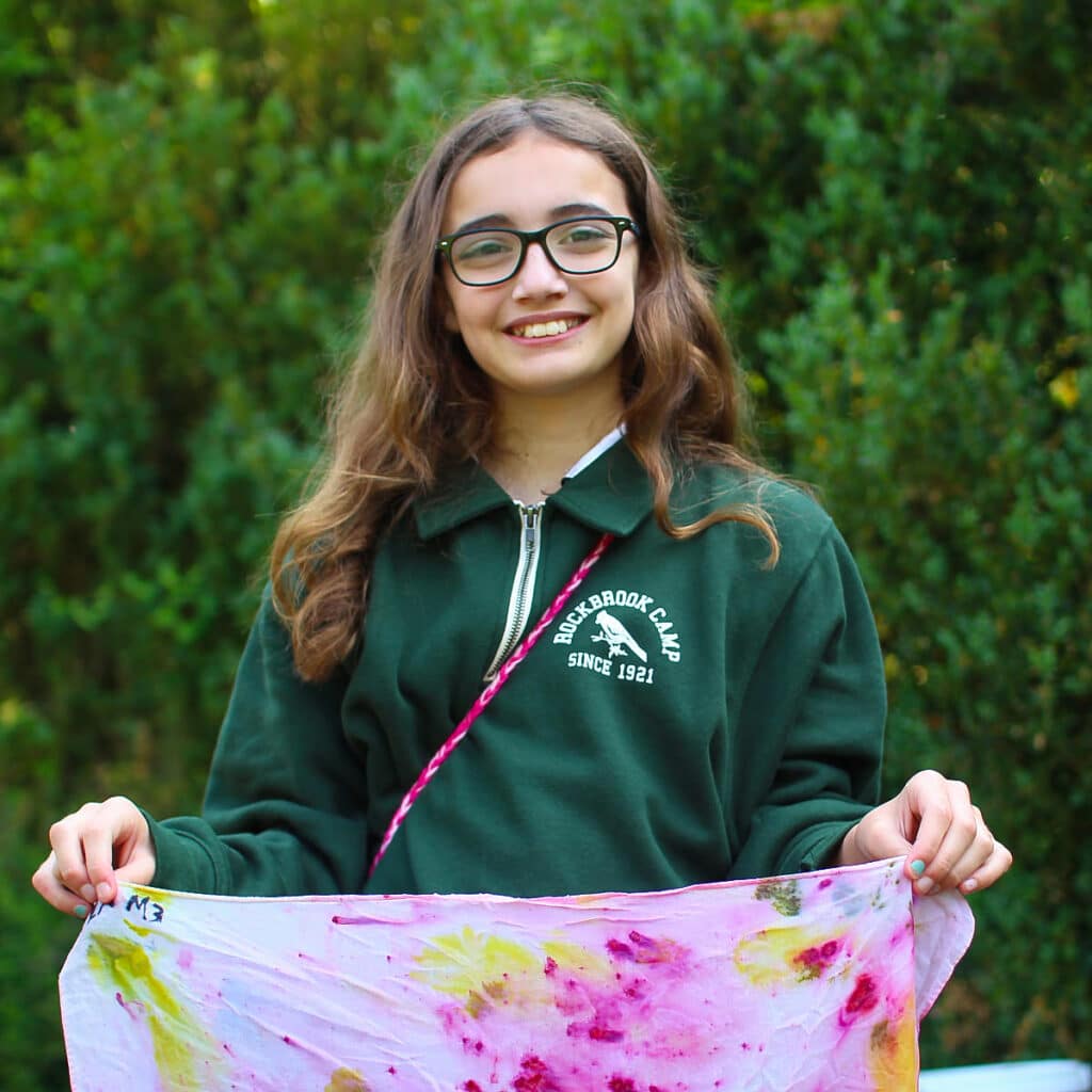 kid holding dyed fabric