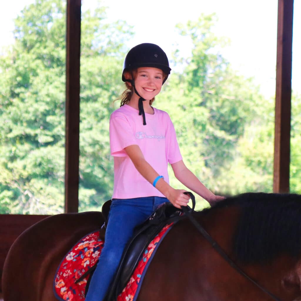 happy girl riding horse