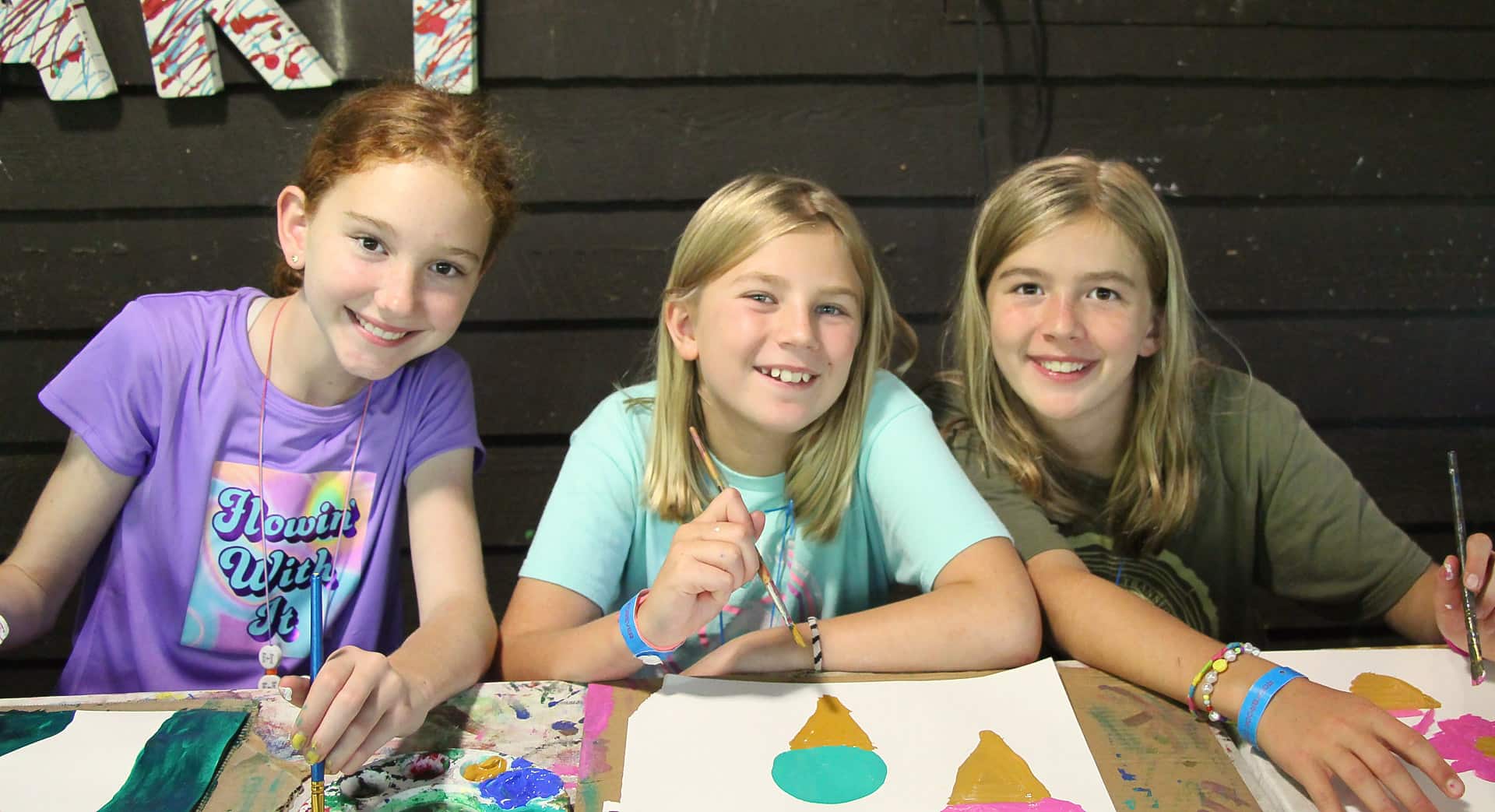 Painting girls at summer camp