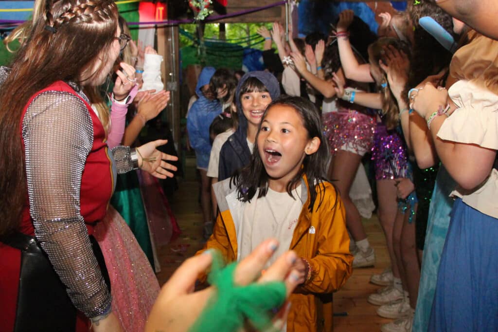 girl surprised by camp party