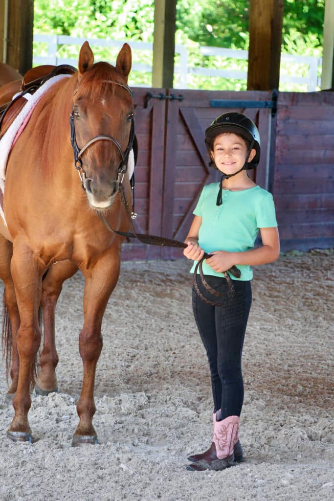 young summer camp horse rider