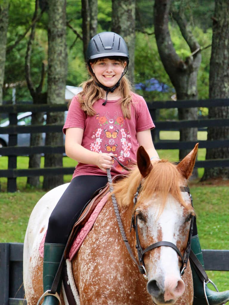 summer camp horseback riding girl