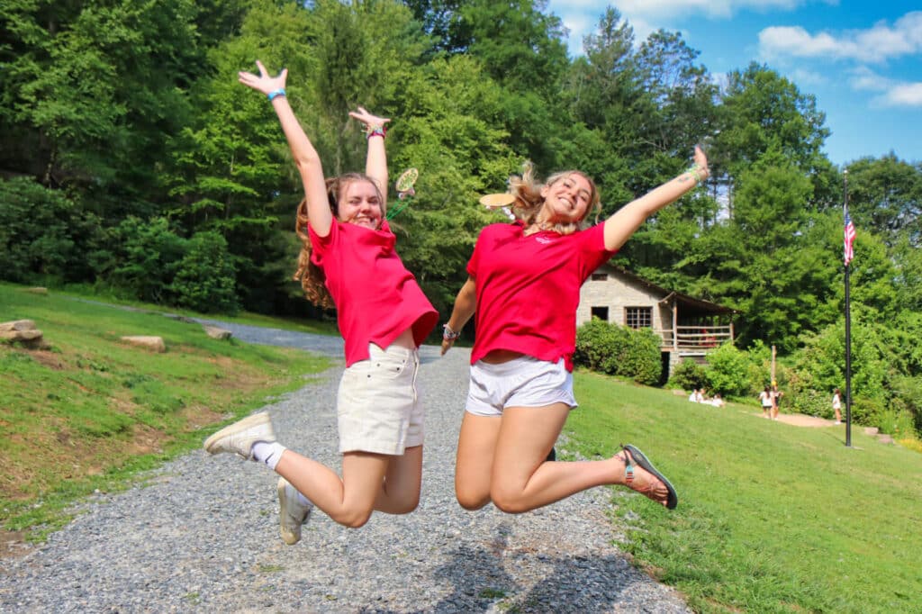 excited camp staff jumping