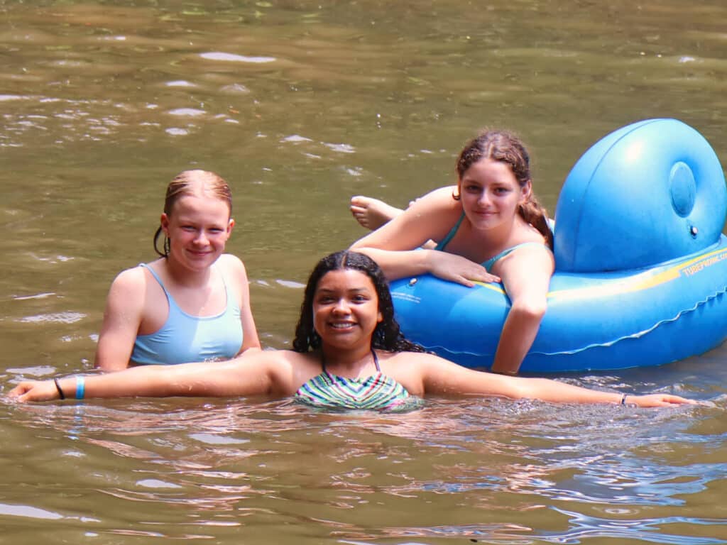 summer camp children relaxing in the lake