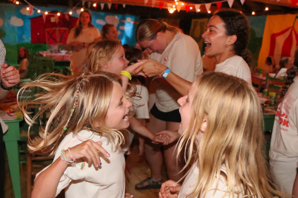 kids dancing and singing at summer camp