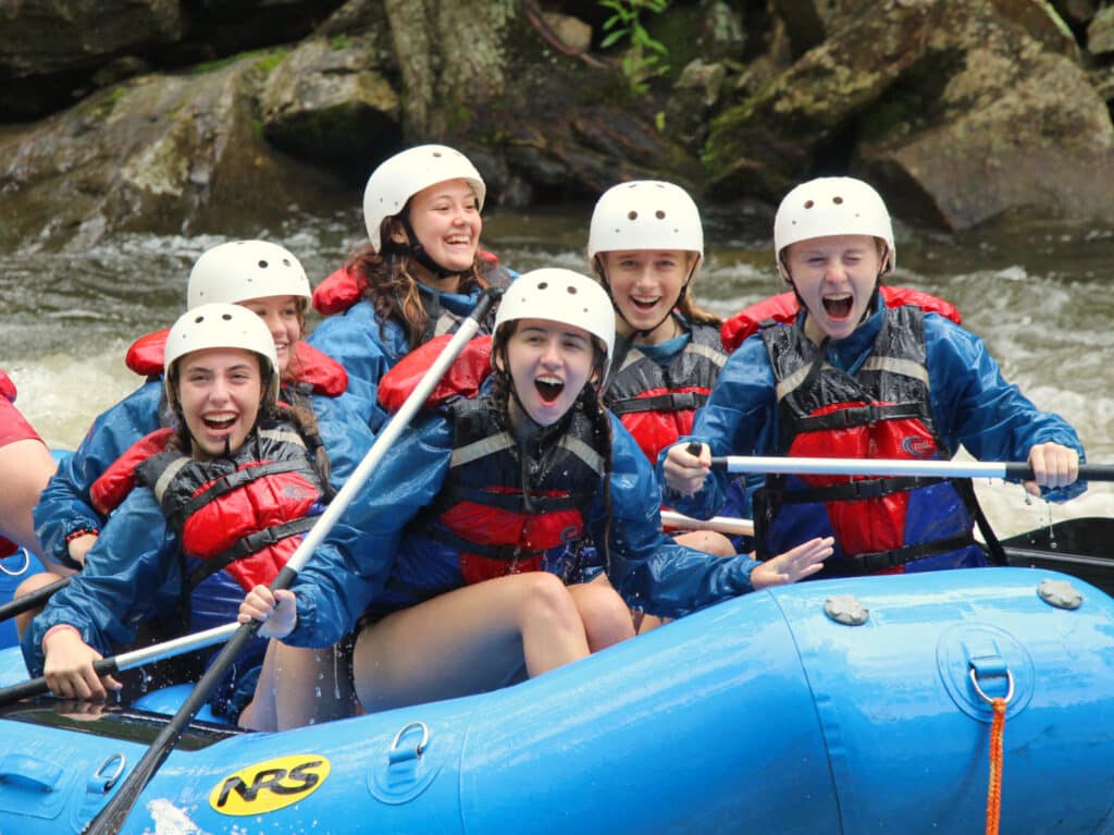teenage girls on whitewater rafting trip