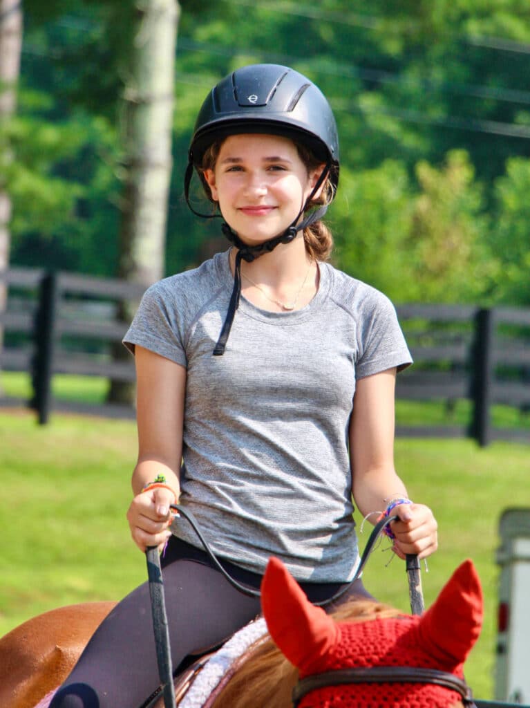 girl child riding a horse