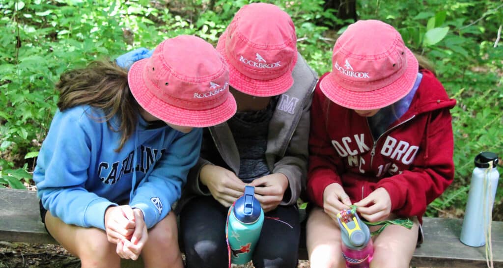three rockbrook camp girls wearing bucket hats