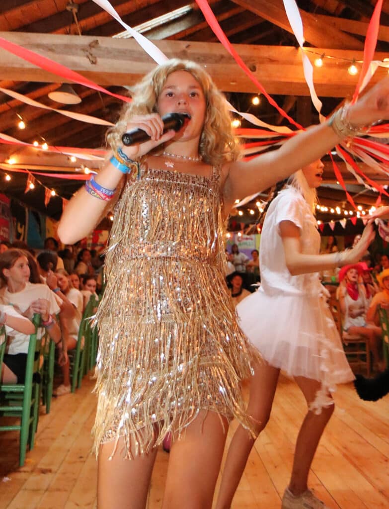 girl singer wearing gold dress