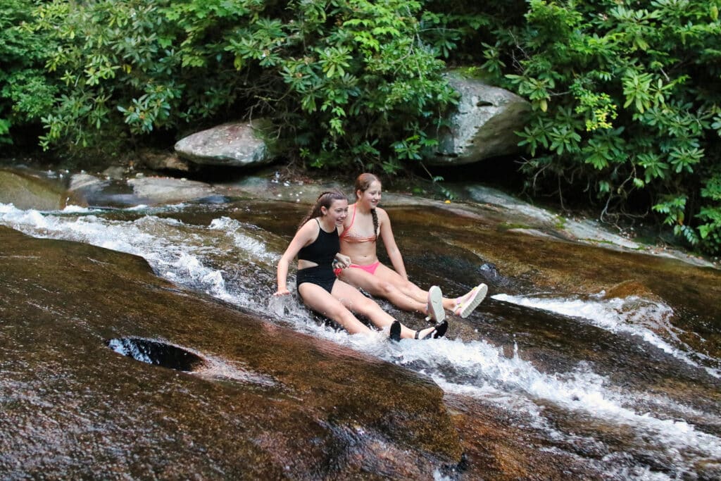 two kids on sliding rock in north carolina