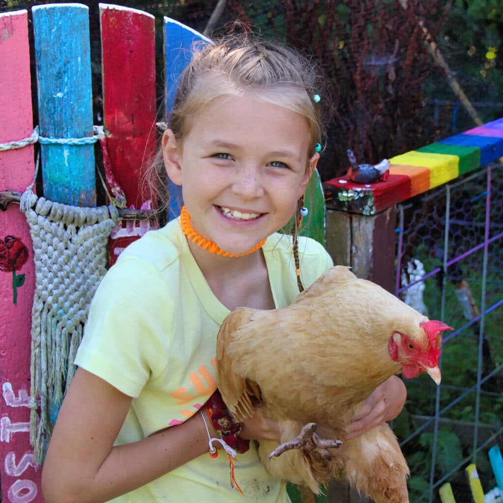 camp girls with chicken