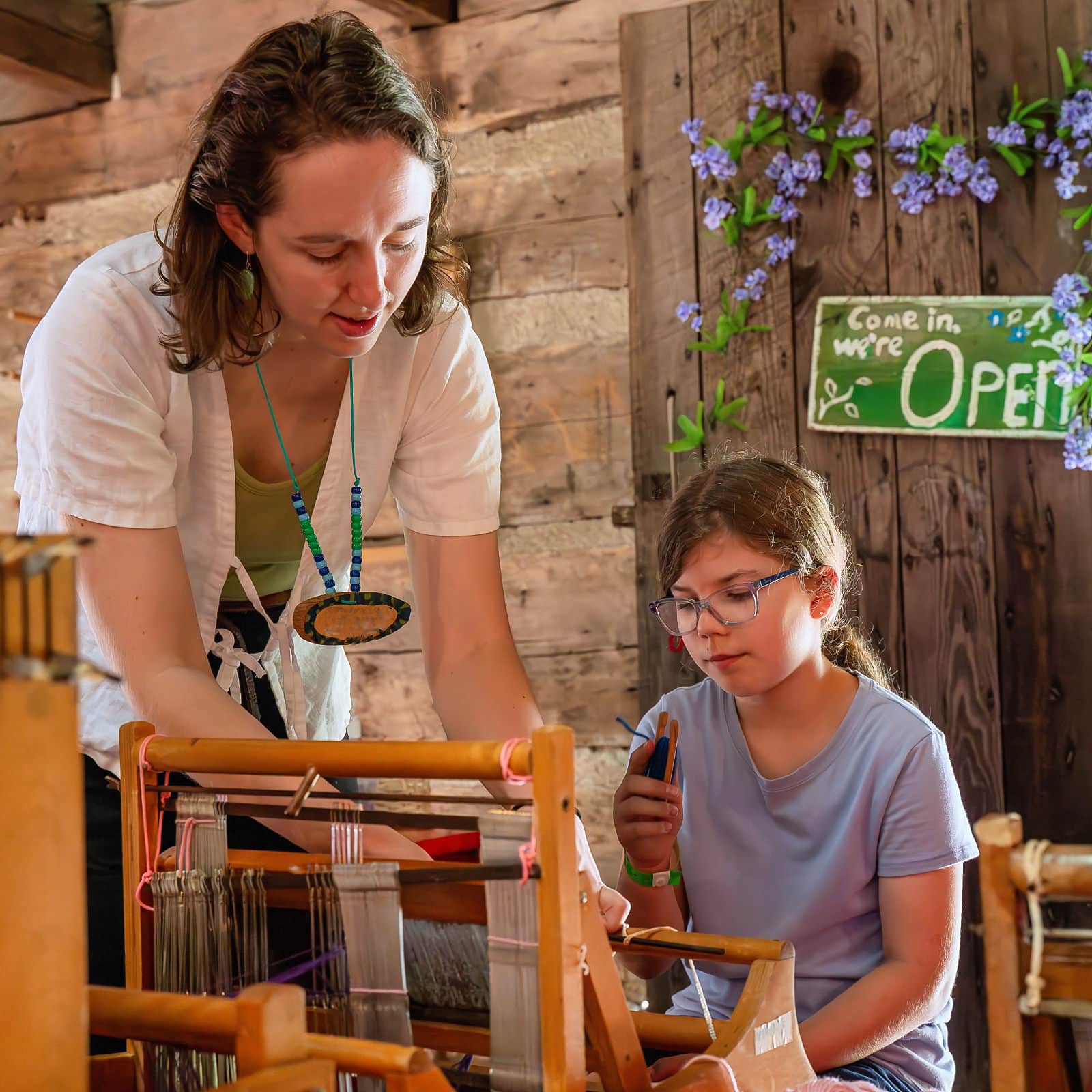 camp teaching weaving