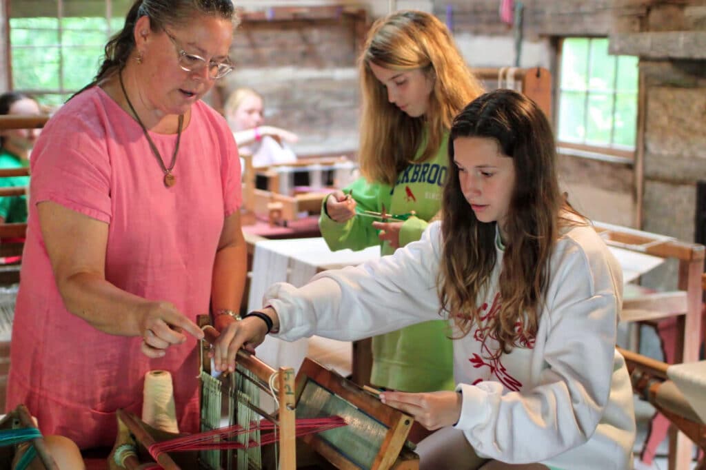 learning to weave at summer camp