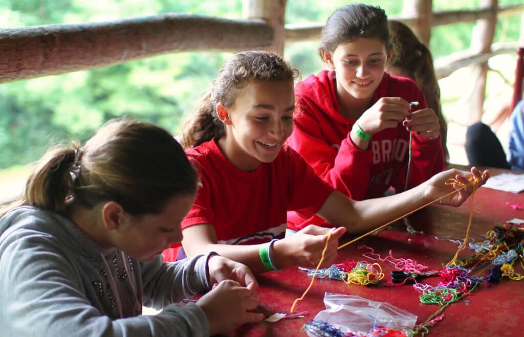 summer camp jewelry making group of girls