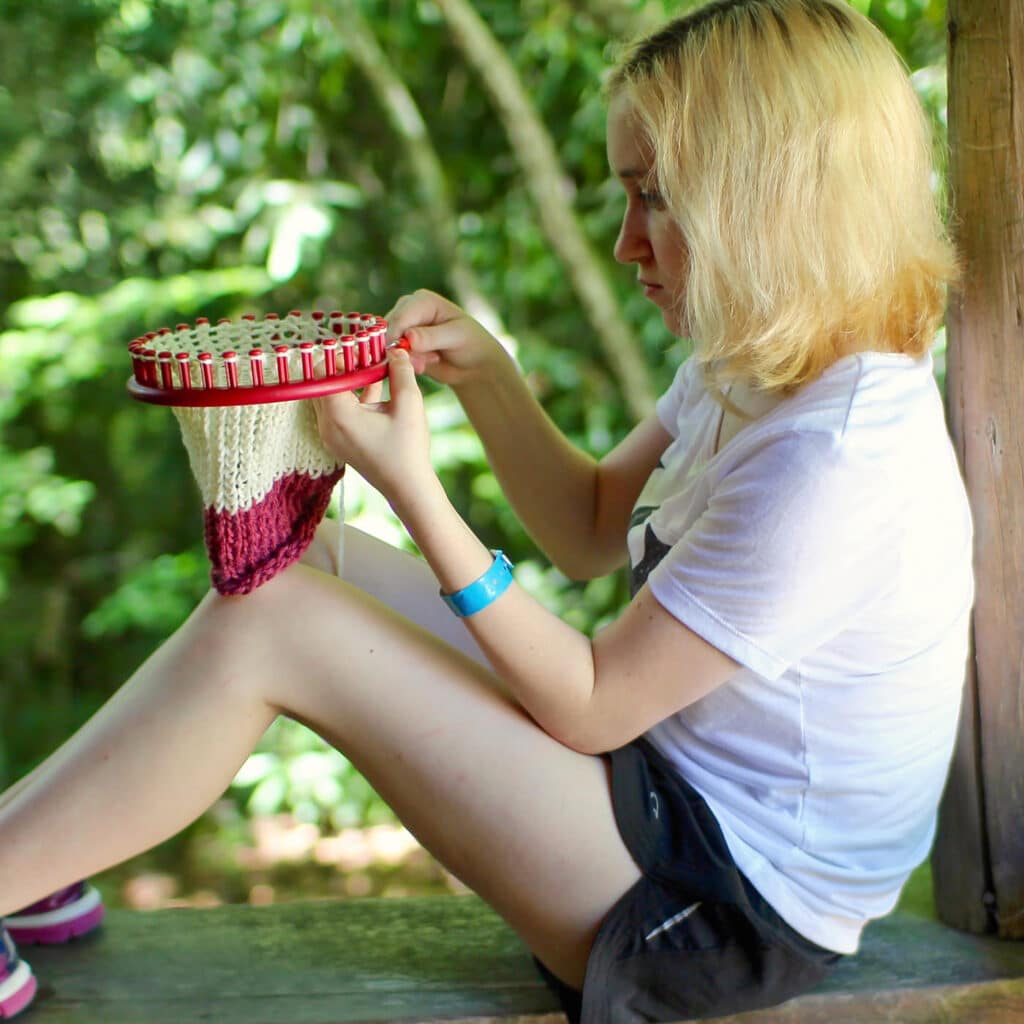 needle craft girl with ring knitter