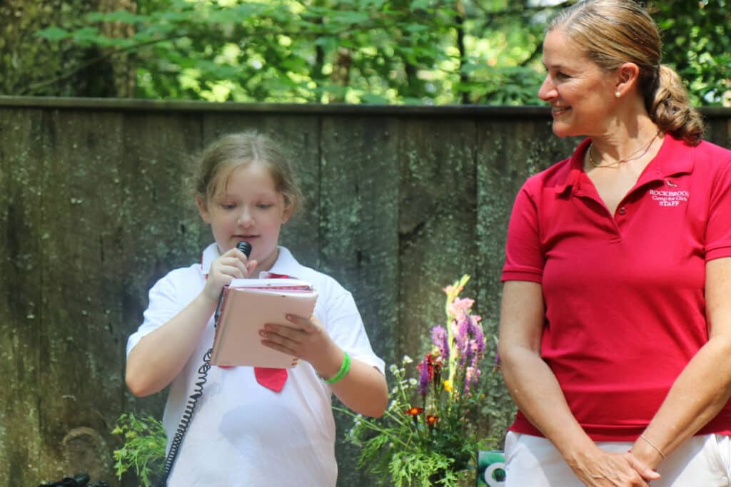 camper girl reading a poem