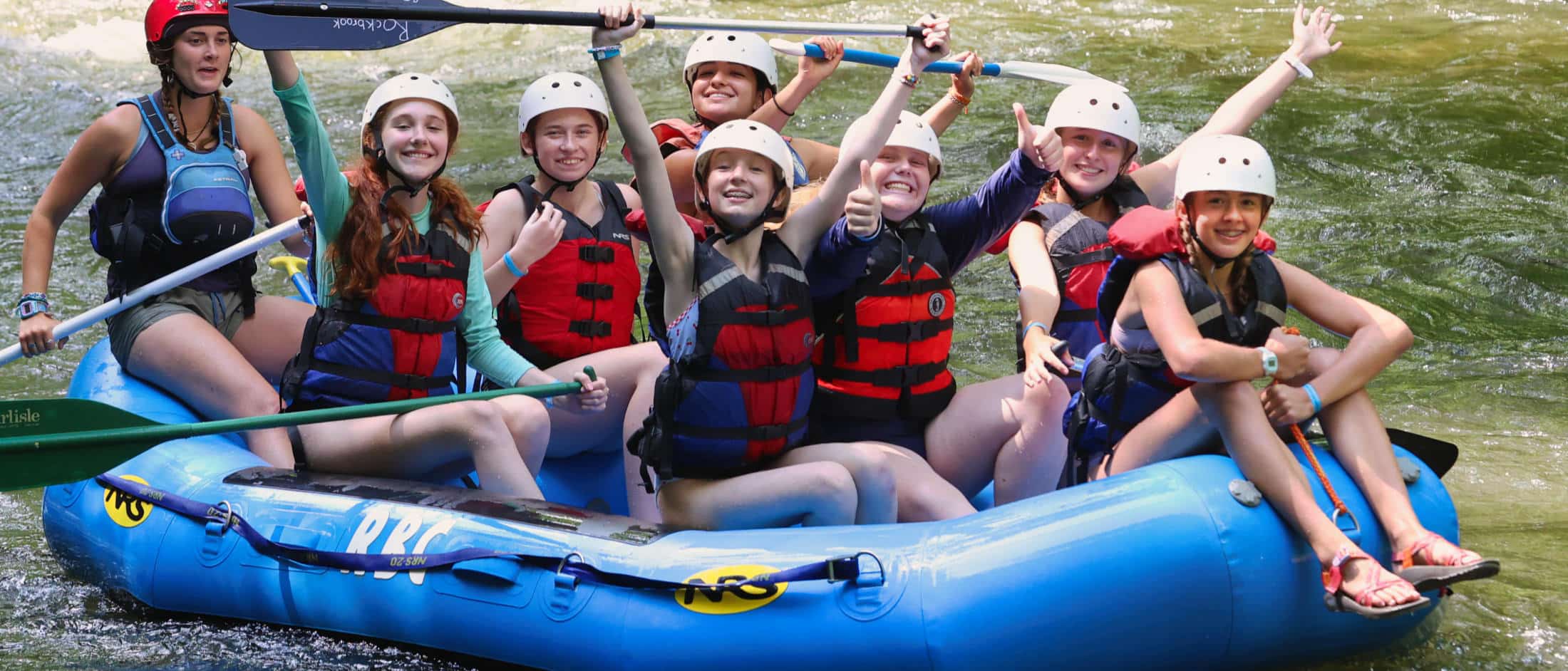 teenage camp girls rafting